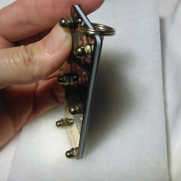 COPY - LOUIS VUITTON KEY FOB / JUST REMOVED PLASTIC LIKE NEW UNUSED GOLD/ BLACK… - Picture 6 of 13